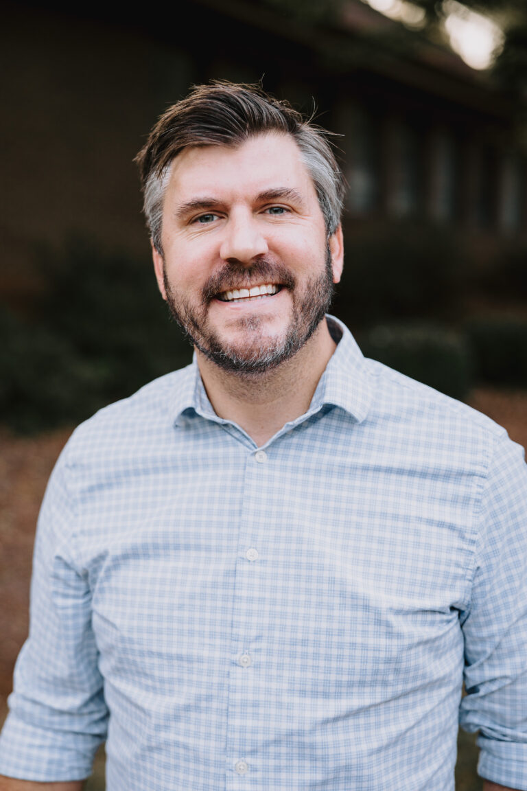 Male dentist smiling