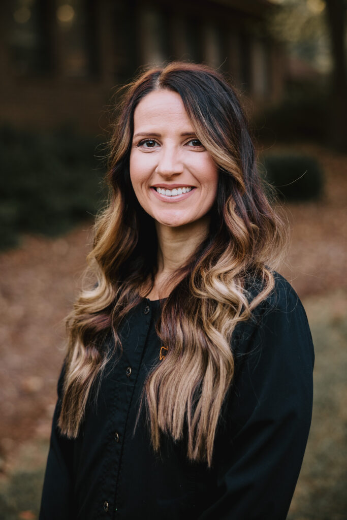 Young female hygienist smiling.